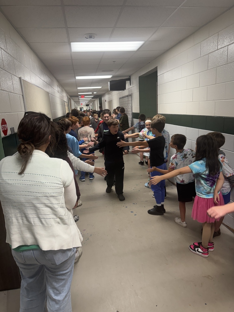 kids and teachers hugging goodbye
