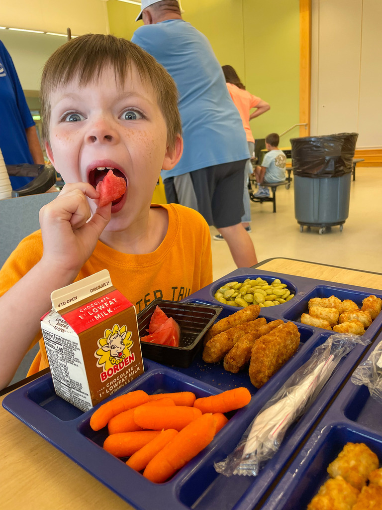 an SCPS student enjoying the watermelon!