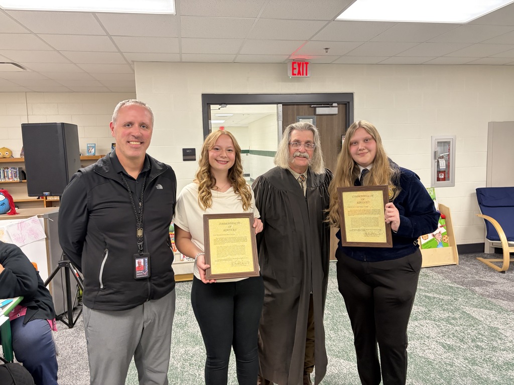 A group photo of Superintendent Matthews, Ms. Garland, Judge Harrod, and Ms. Rainer