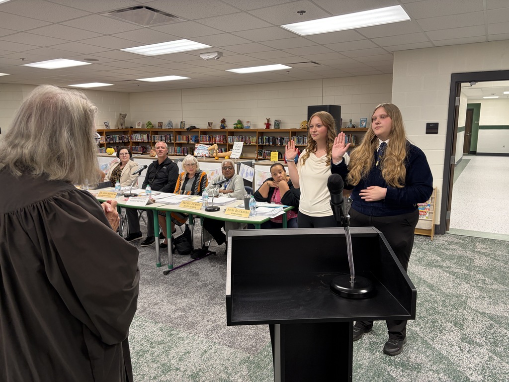Addison and Katie being sworn in by Senior Judge Harrod