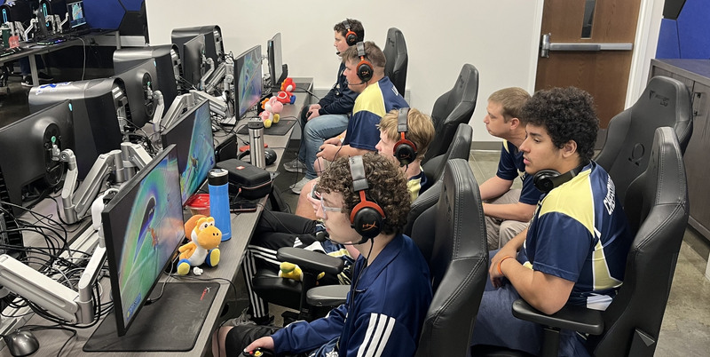 The Blue Shellbys playing a match in Mario Kart 8 Deluxe. Headphones allow them to easily communicate during races.