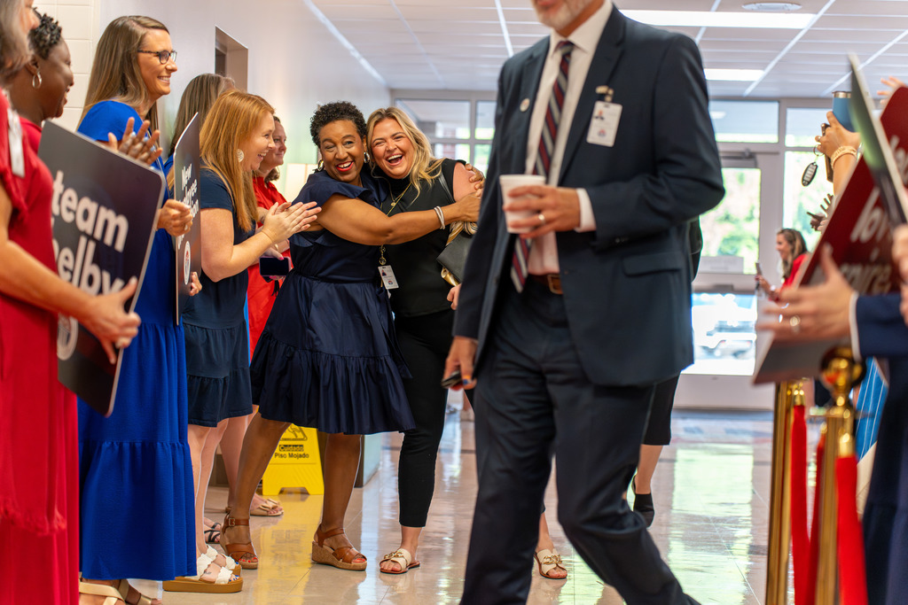 Hugs all around on the morning of New Employee Orientation.