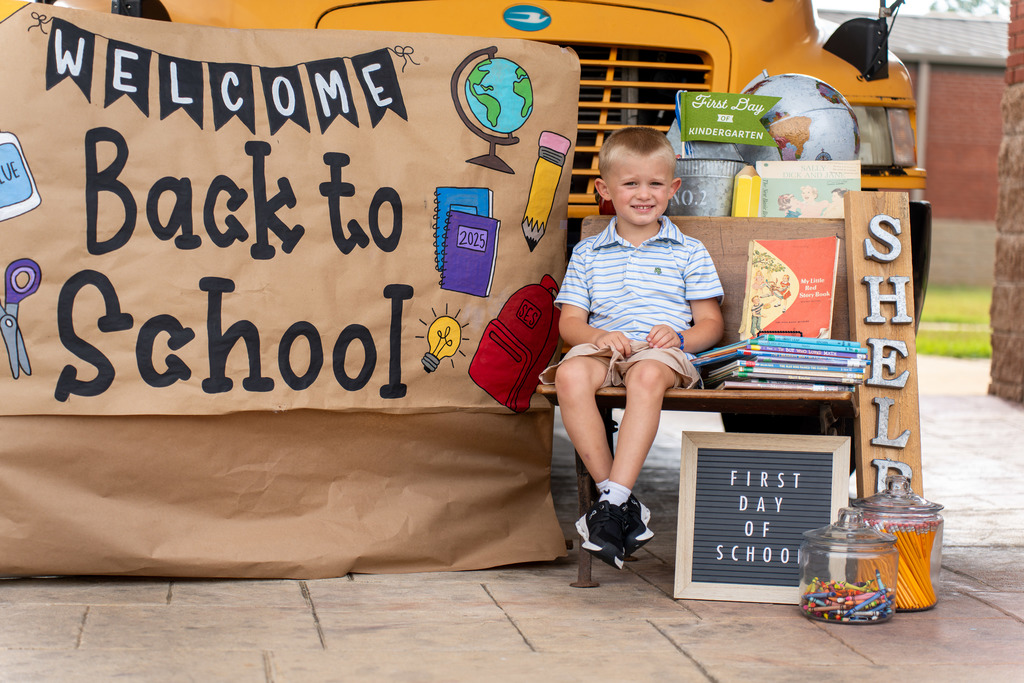 Student poses for Back to School photos.
