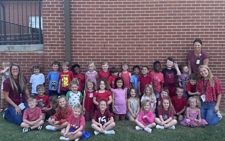 students and teachers wearing red