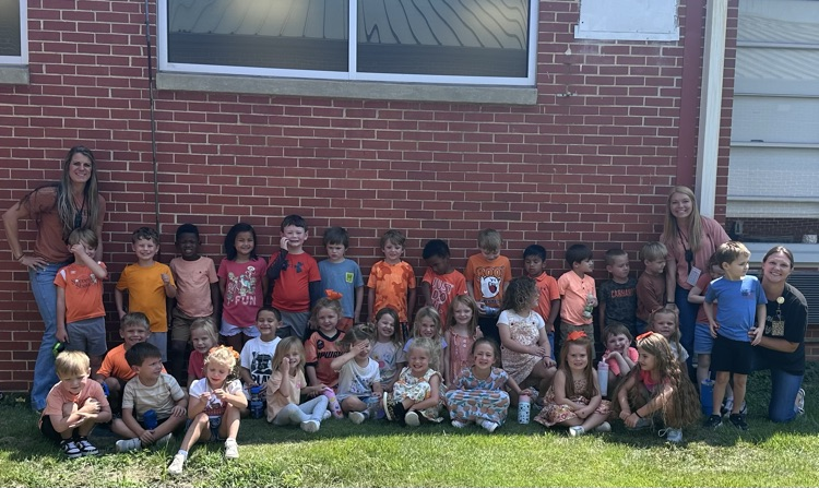 students and teachers wearing orange