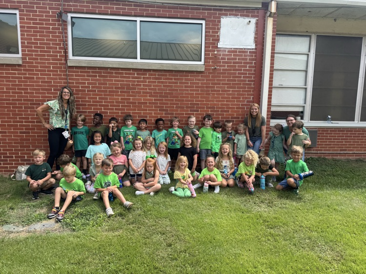students and teachers wearing green