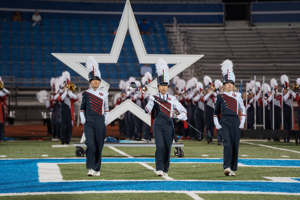 Oak Mountain High School drum majors march toward the sideline.