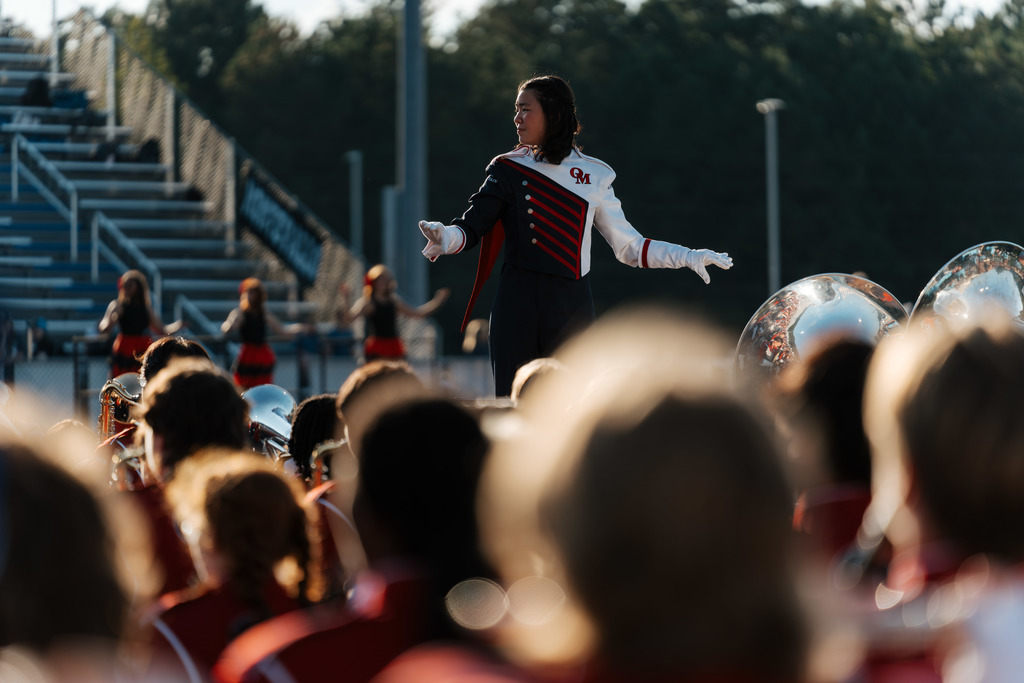 Drum major directs bands.