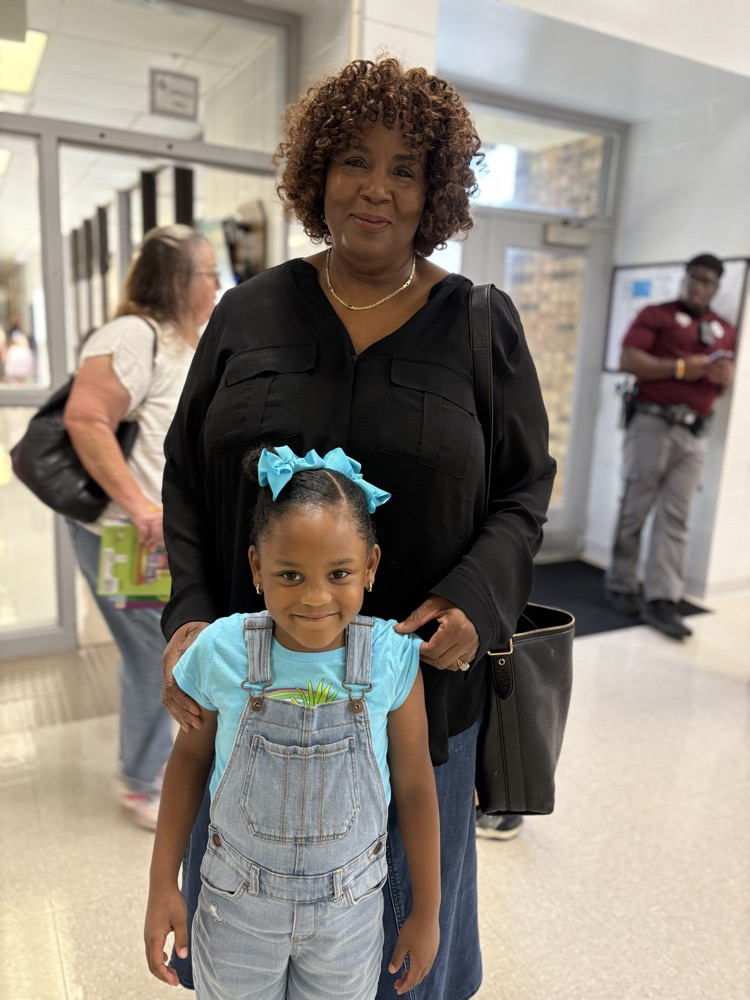 student standing with grandparent 