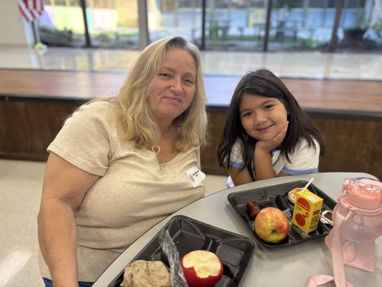 grandmother and granddaughter enjoying breakfast