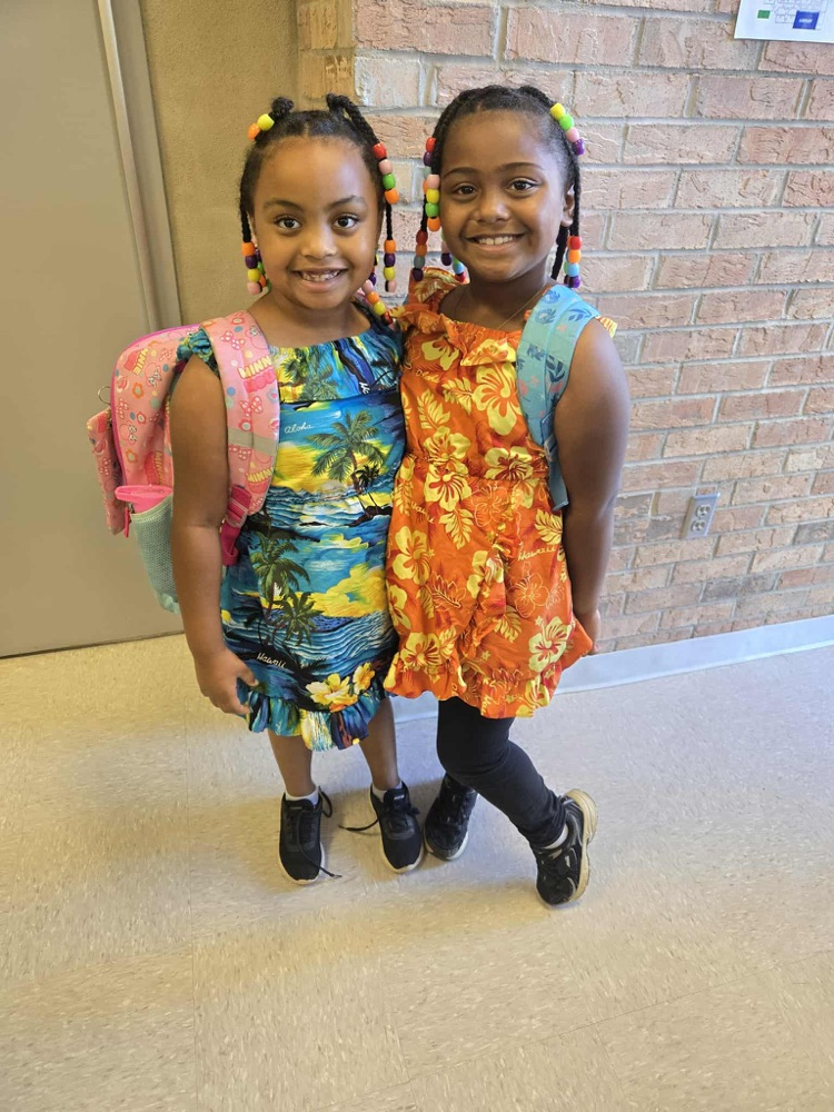 sisters in tropical dresses