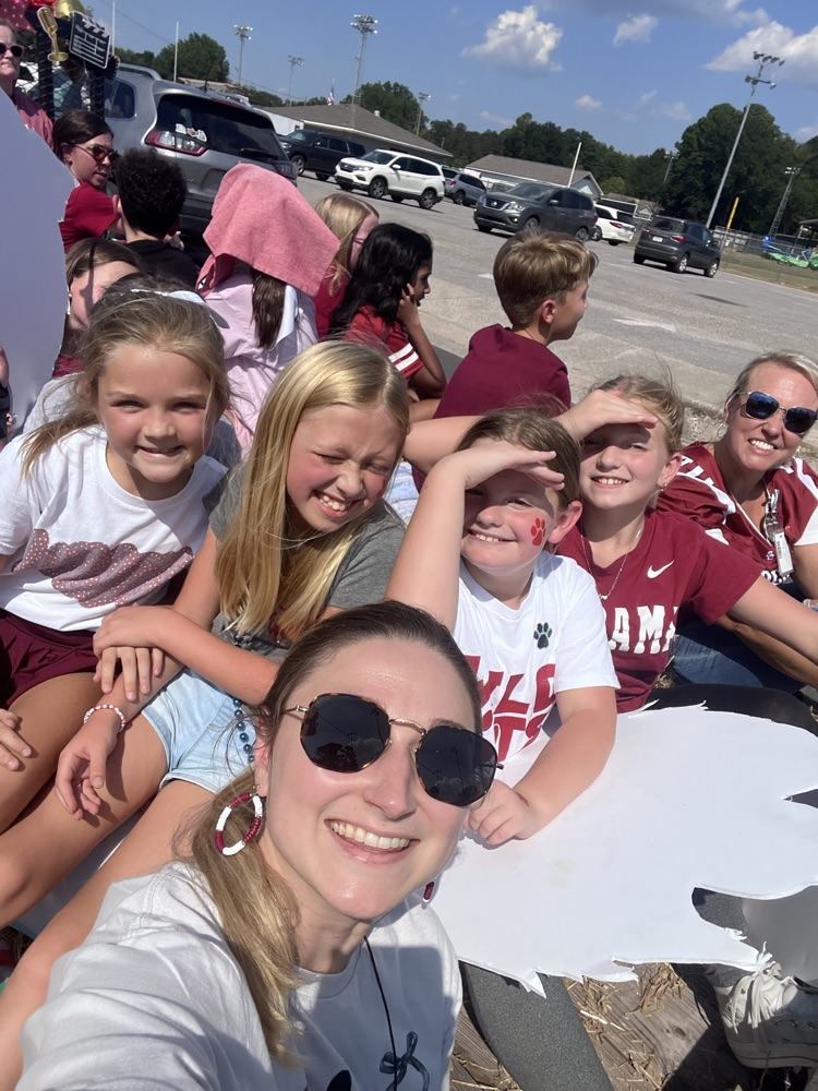 teachers an students on a trailer during the parade
