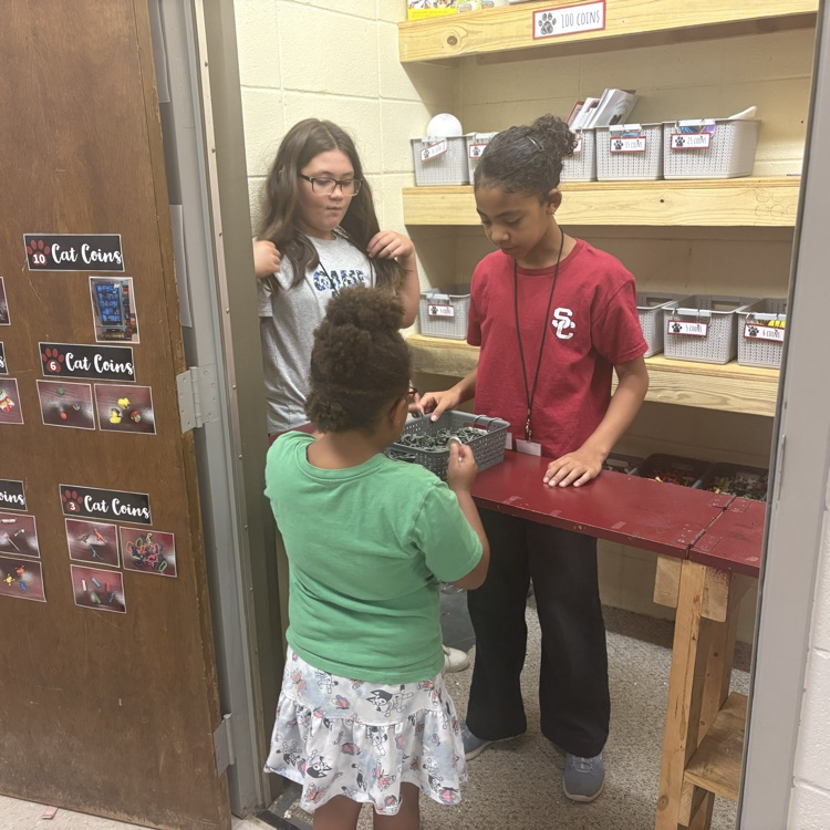 student picking up a prize 
