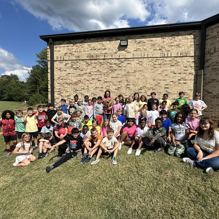 teacher of the year with students 