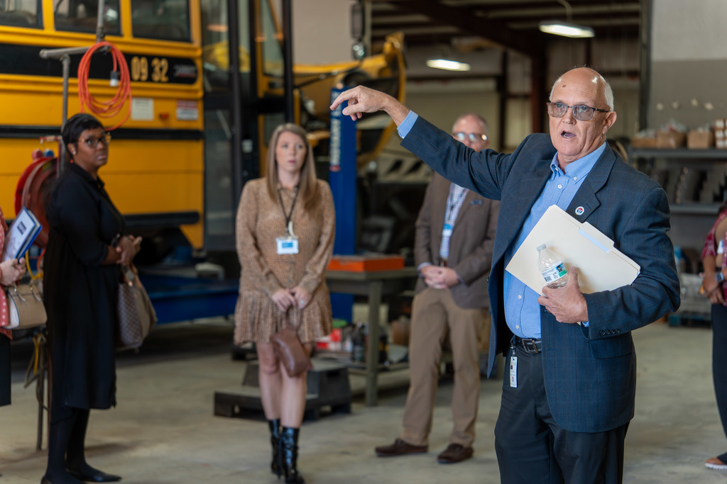 Mr. Vines addresses the Shelby 101 class at the bus shop.