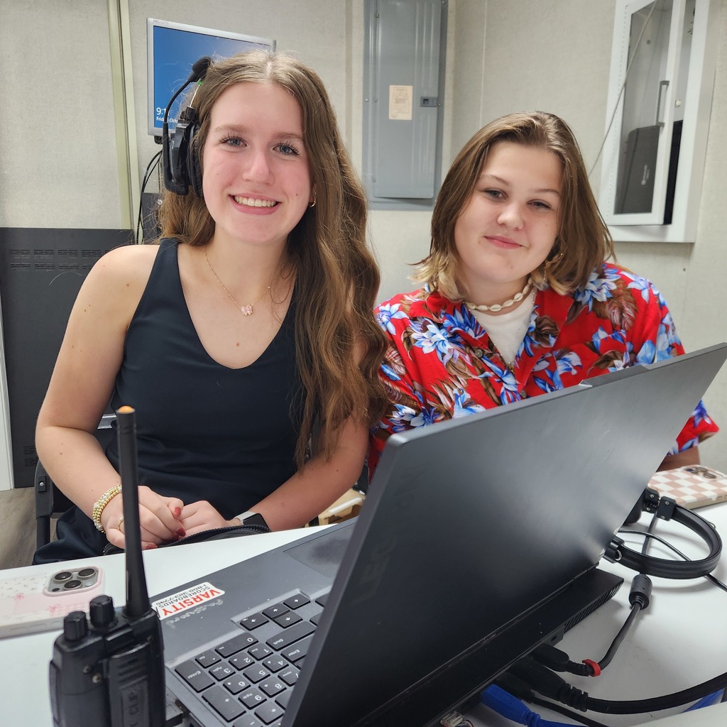 video board workers smile for a picture 