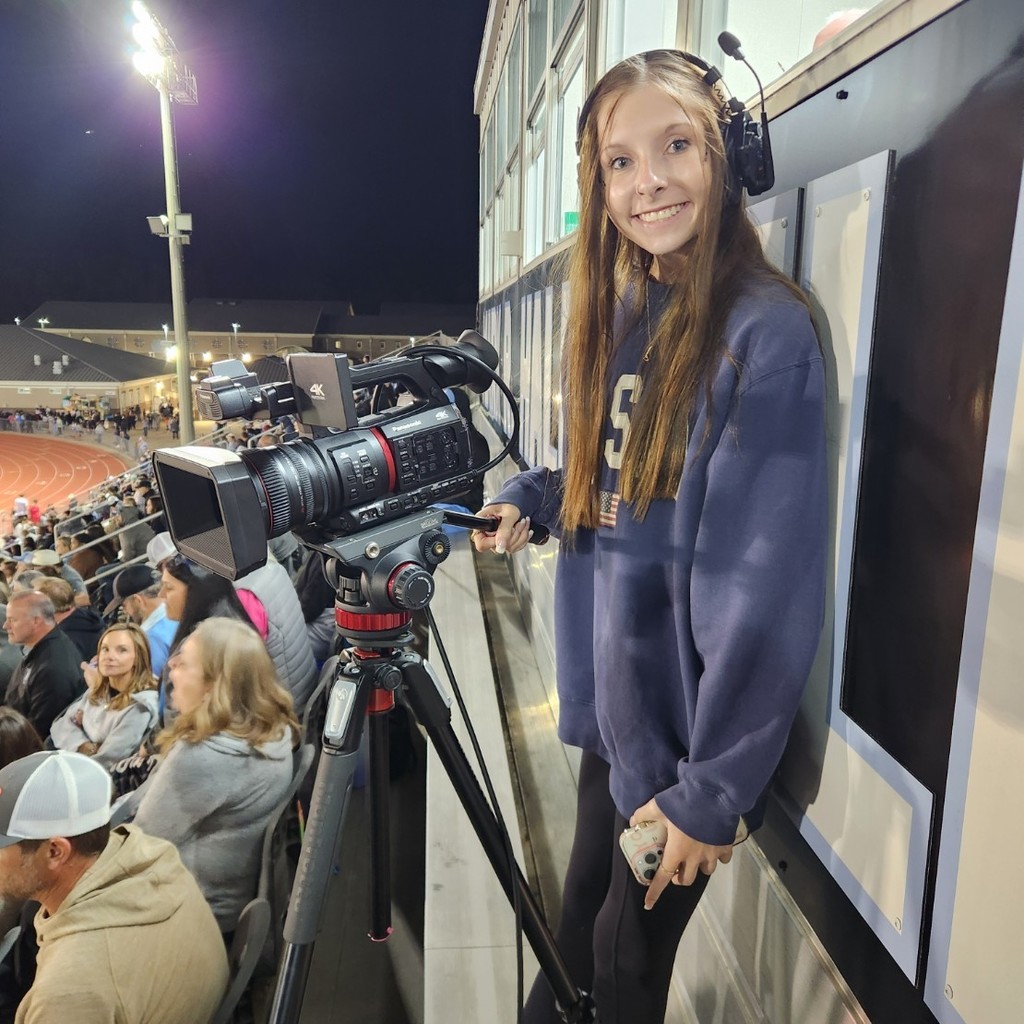 video board worker smiles for a picture 