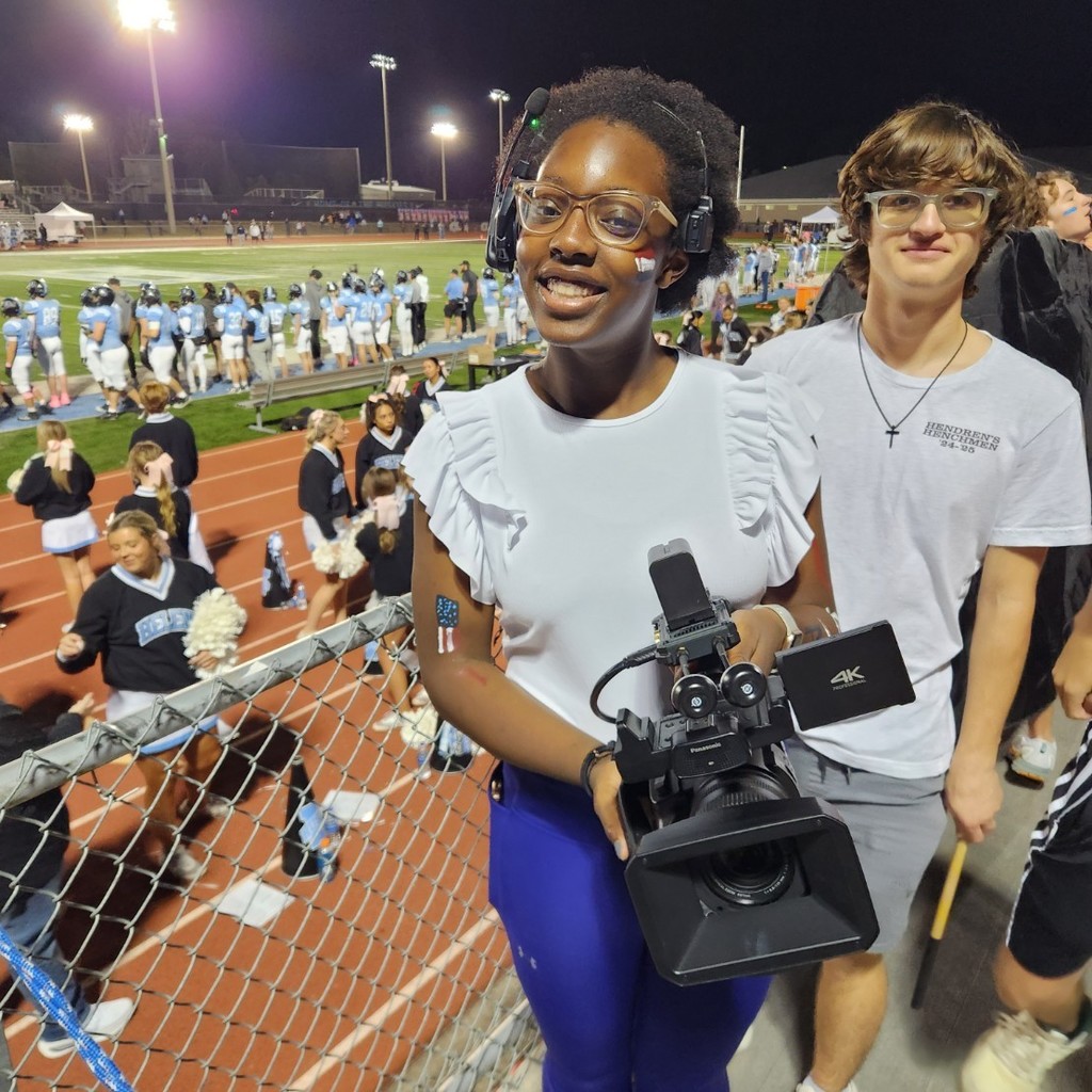 video board worker smiles for a picture