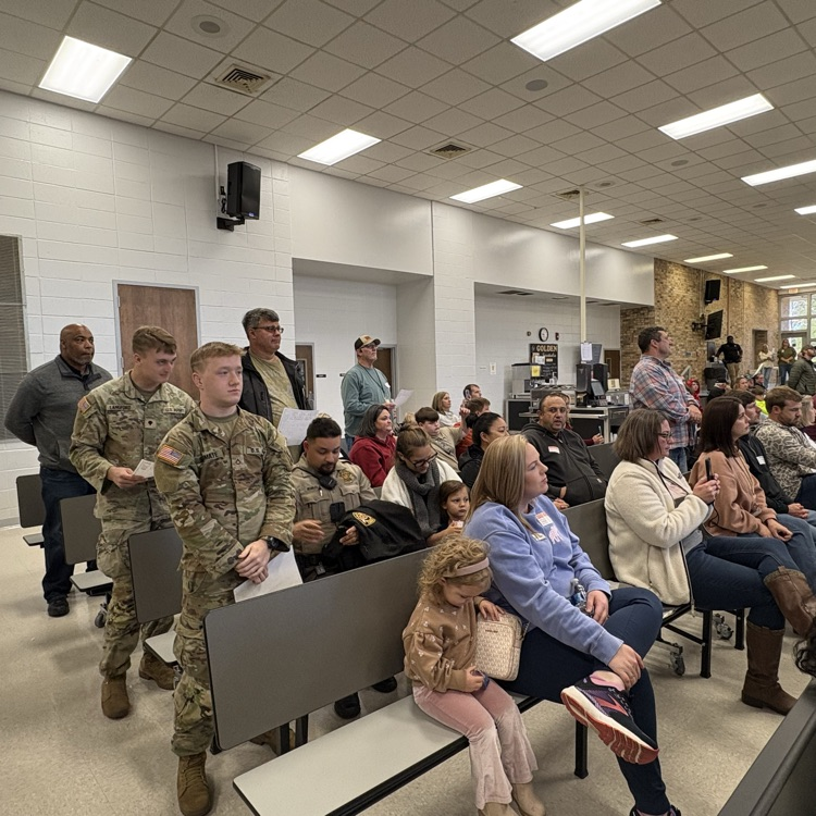 military stand during Veterans Day program  