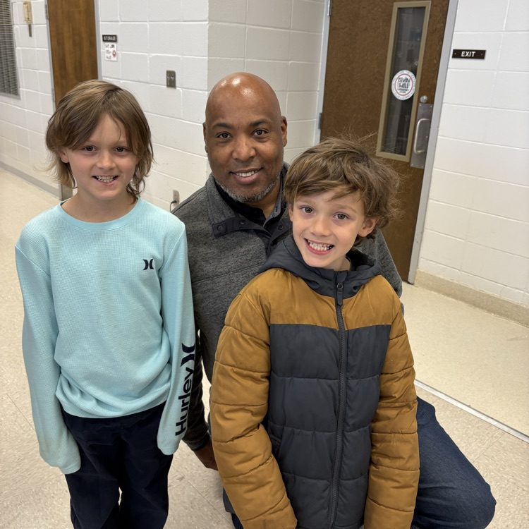 veteran poses with two sons 