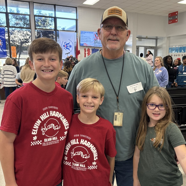 students pose with granddad