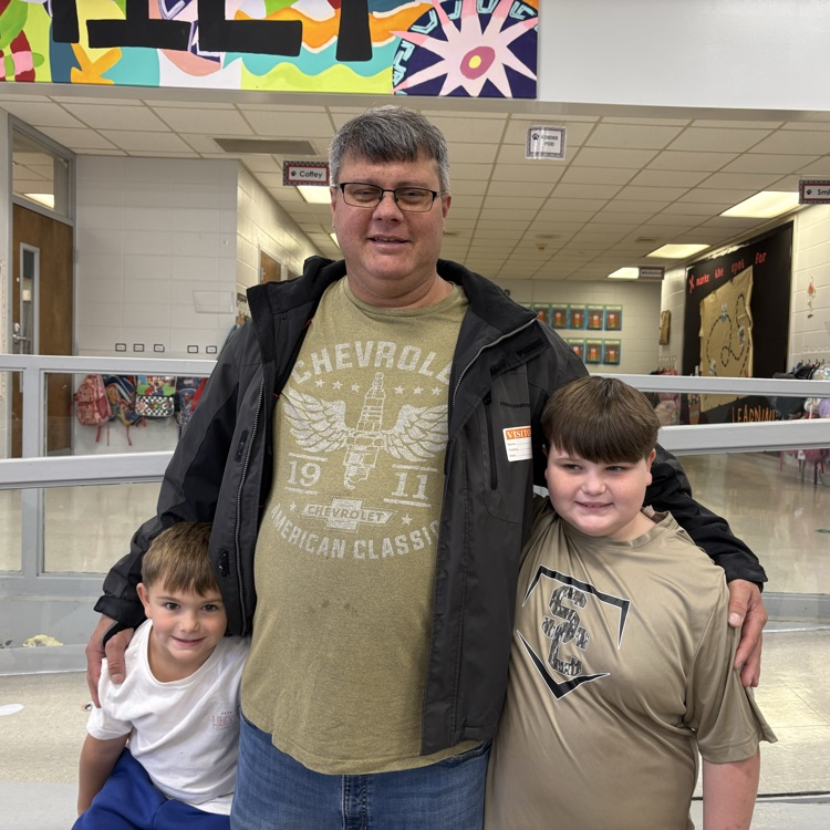 boys pose with uncle