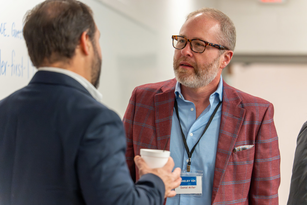 Attendees mingle at Shelby 101.