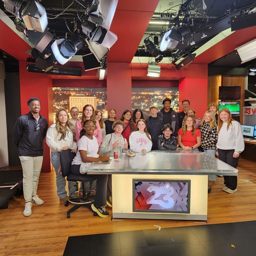 Students in a group on the set of WVUA news