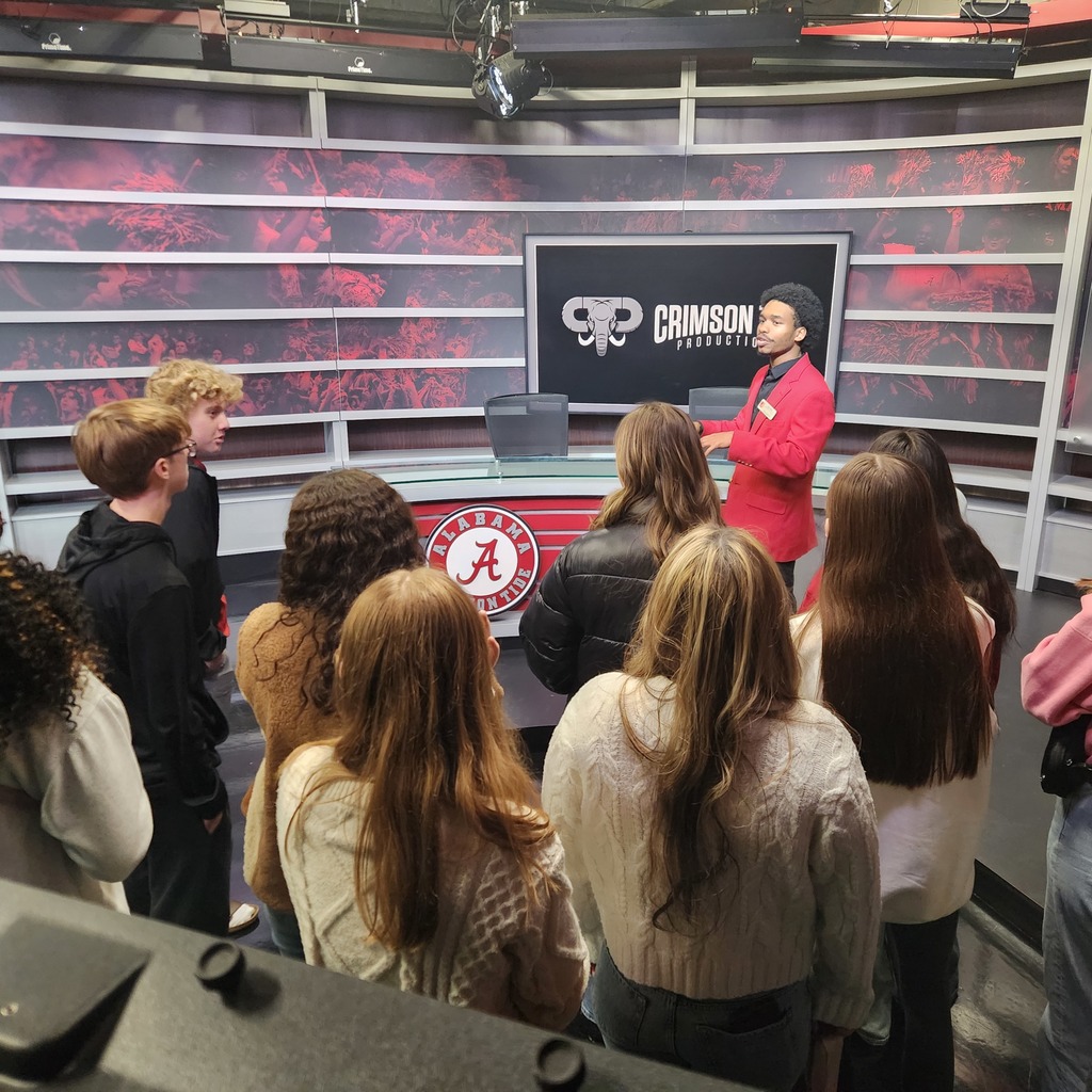 Students in Crimson Tide Productions listening to a presentation