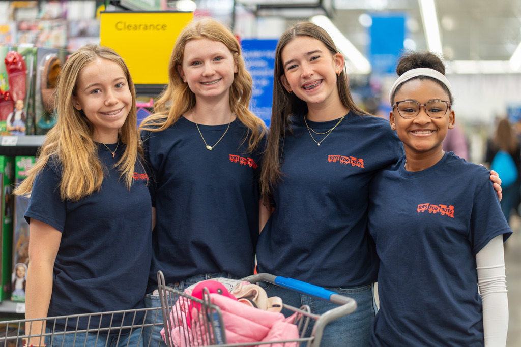 Toys for Tots - four students shopping 