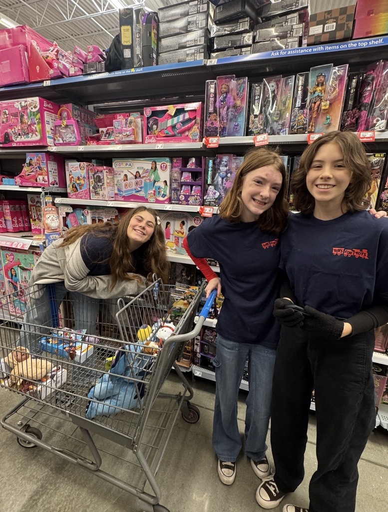 Students shopping at Walmart for Toys for Tots