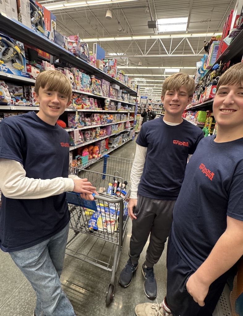 Students shopping at Walmart for Toys for Tots