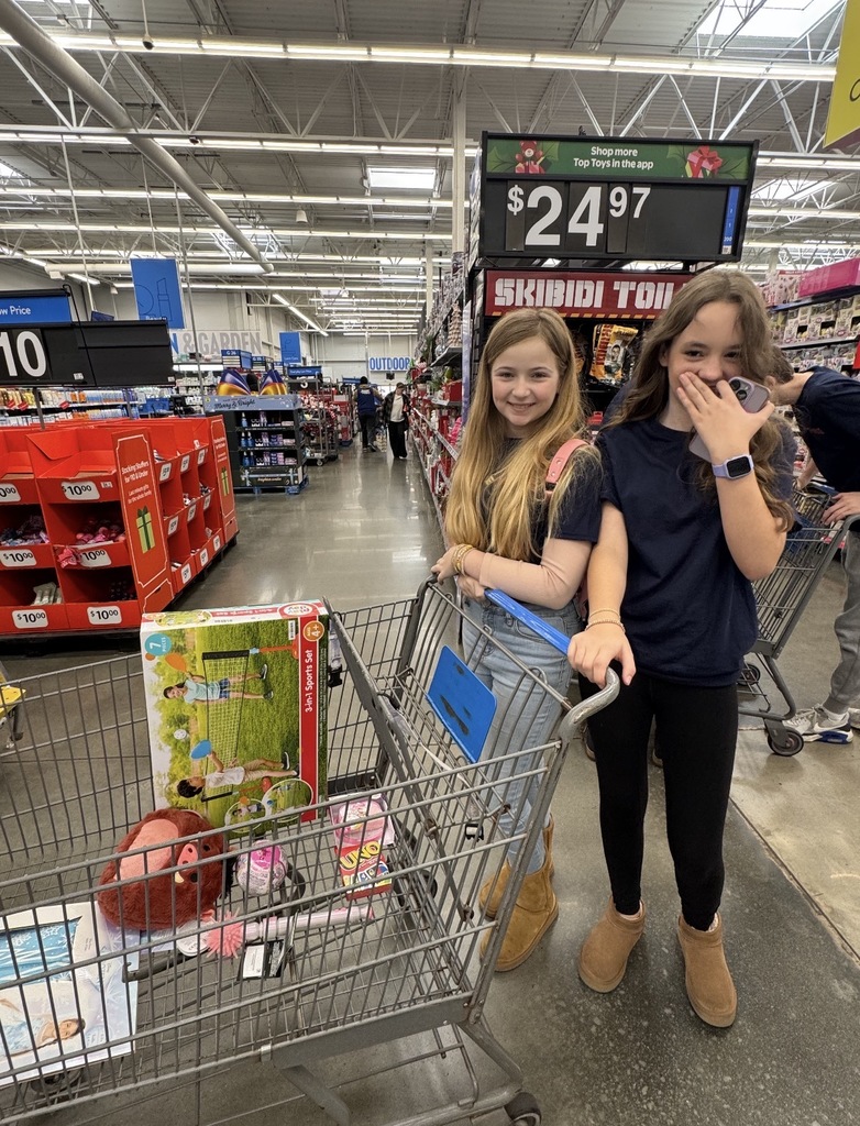 Students shopping at Walmart for Toys for Tots