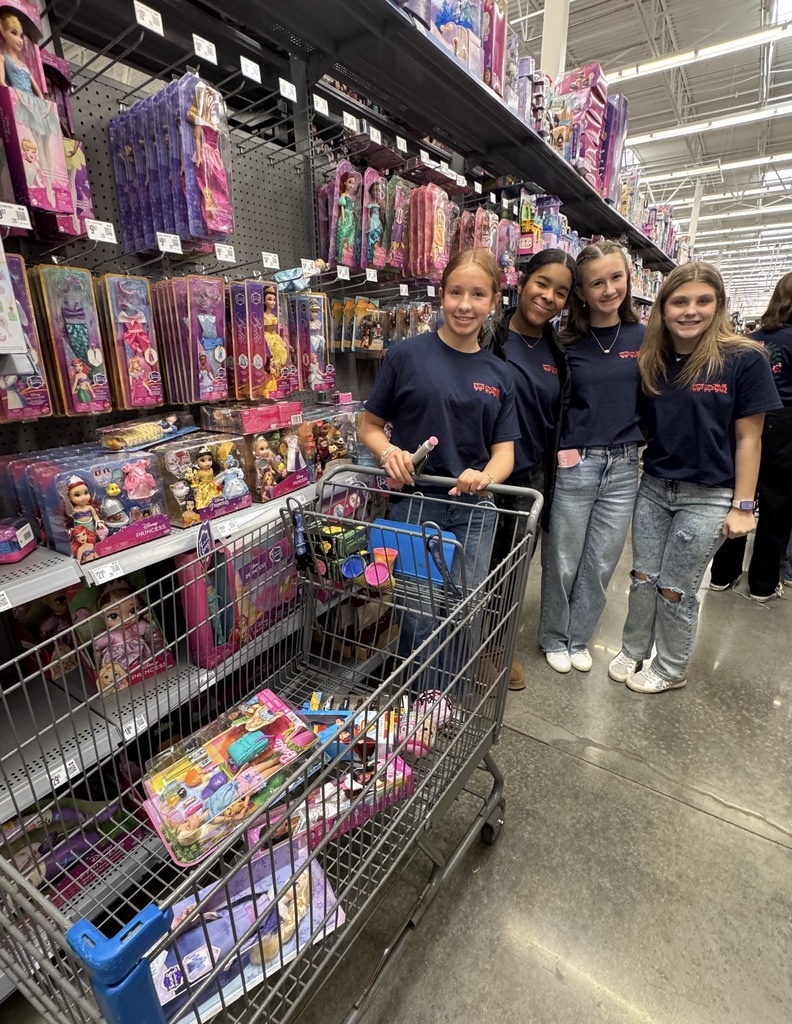 Students shopping at Walmart for Toys for Tots