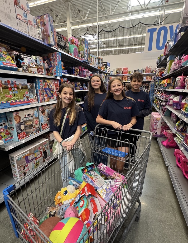 Students shopping at Walmart for Toys for Tots