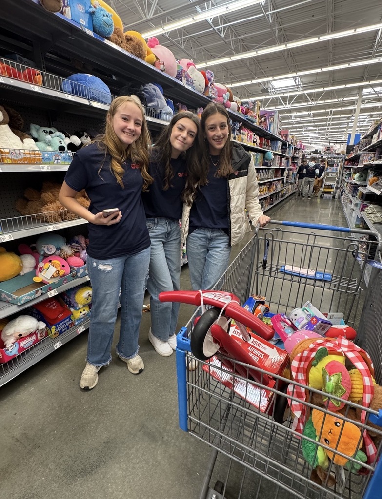 Students shopping at Walmart for Toys for Tots