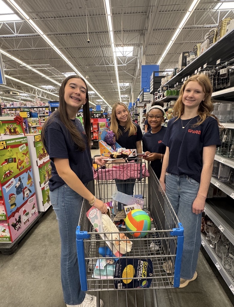 Students shopping at Walmart for Toys for Tots