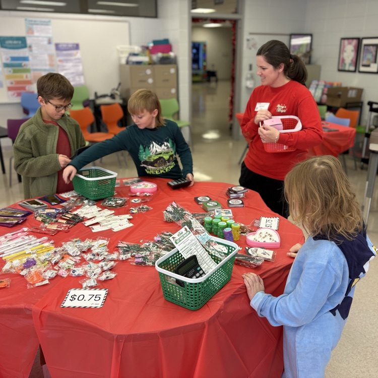 students shop with volunteer  