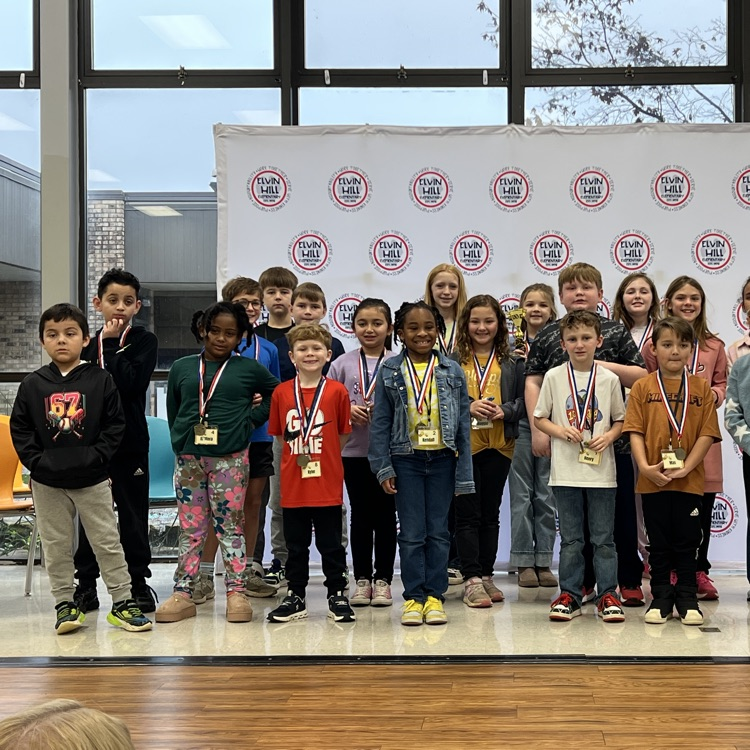 student spelling bee participants posing for a group picture 
