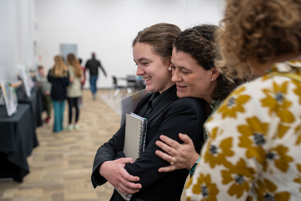 Attendees browse the art selections.