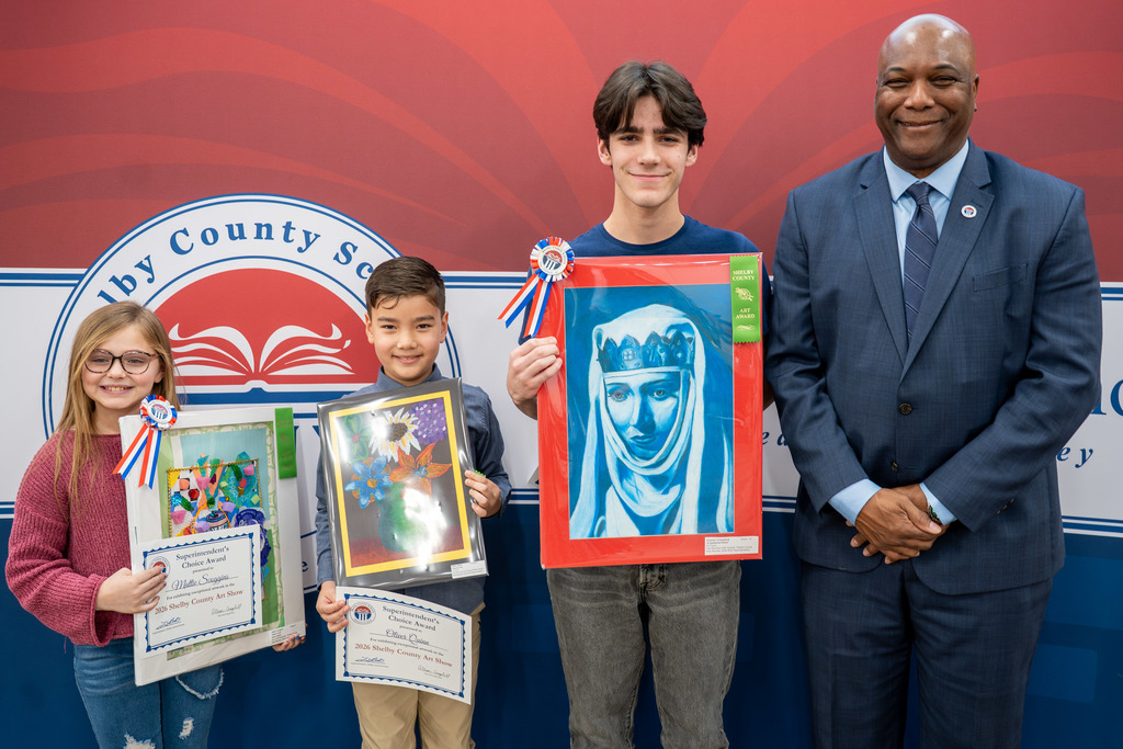 Dr. Brooks poses with the students that received the Superintendent's Choice Award.