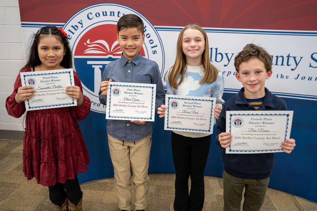 Students pose with their awards.