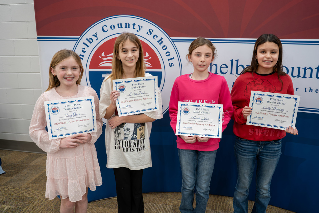 Students pose with their awards.