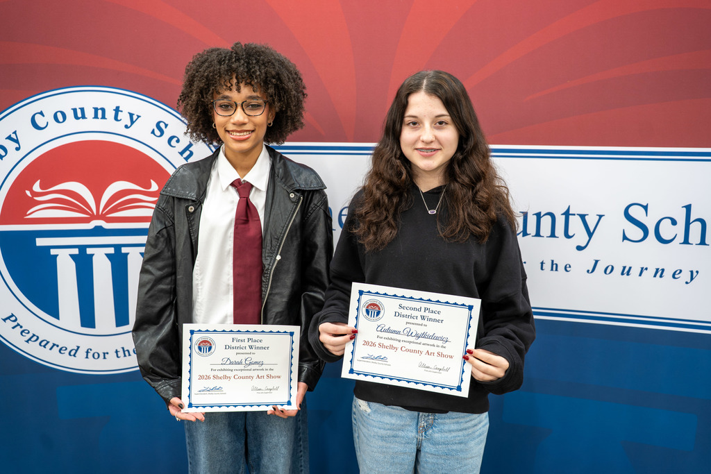 Students pose with their awards.