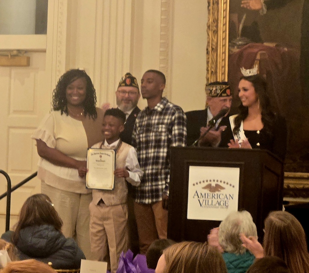 Kingston receiving his award with family