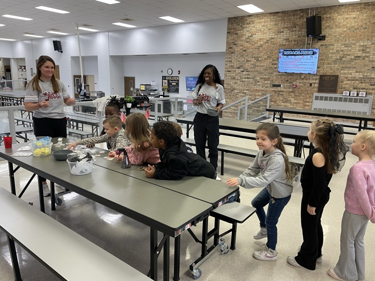 students apply temporary tattoos on administrators 