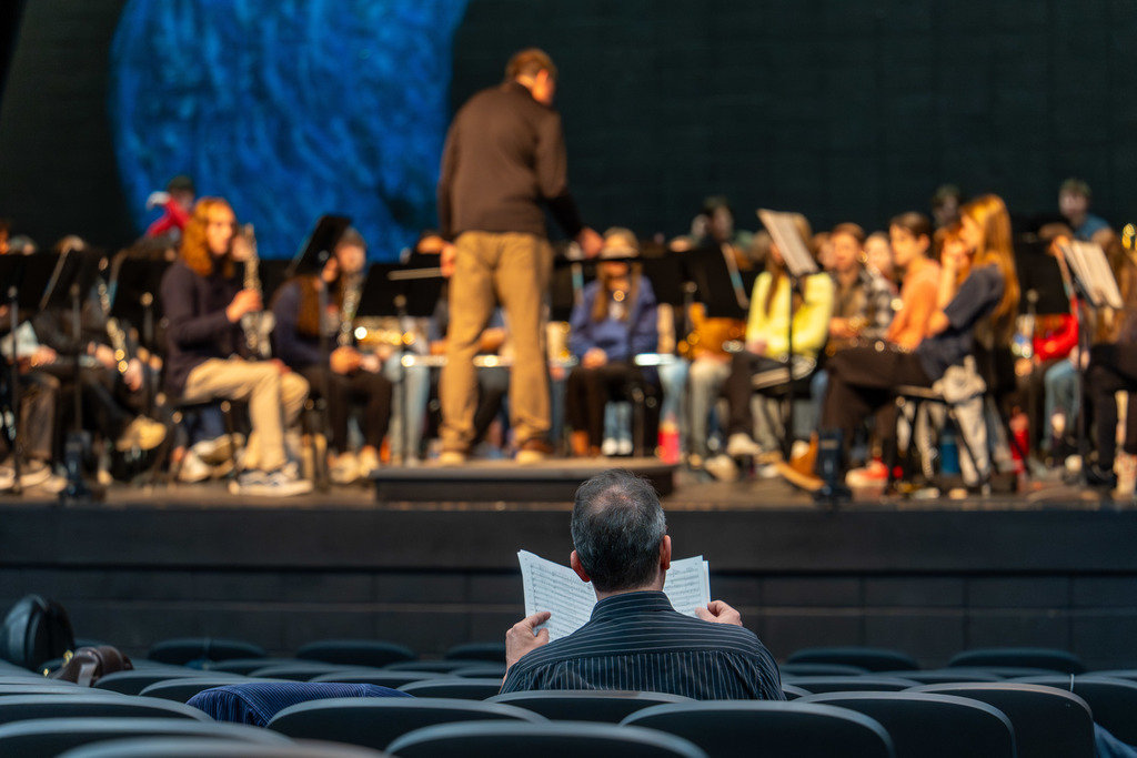 Mr. Galante looks over music.