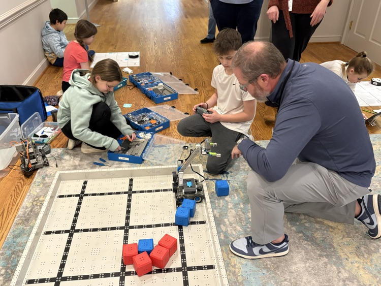 Students demonstrate using the robot on the vex field