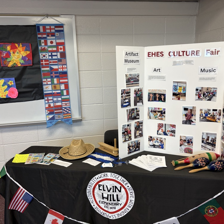 table with cultural artifacts and world flags