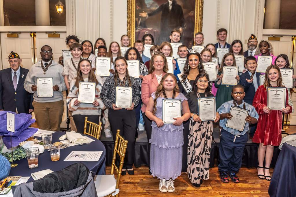 Students posing with their Character In Action awards.